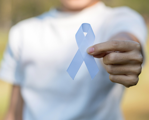 Woman holding white ribbon