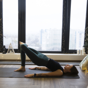 Woman doing yoga to look after her mental health at christmas